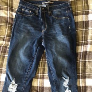 Dark blue ripped jeans